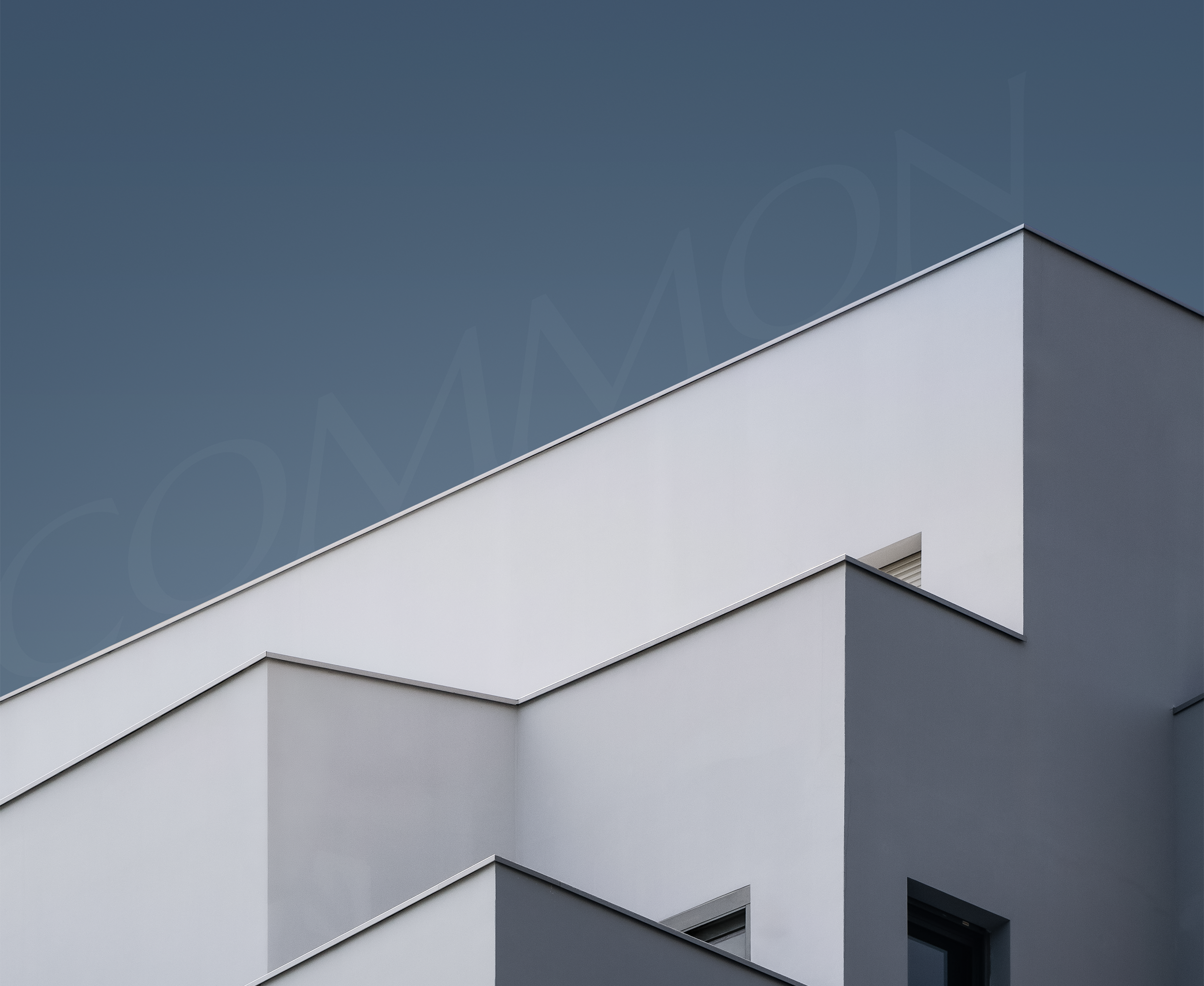 aesthetic white building with blue background sky. common shadow text. dudai uae